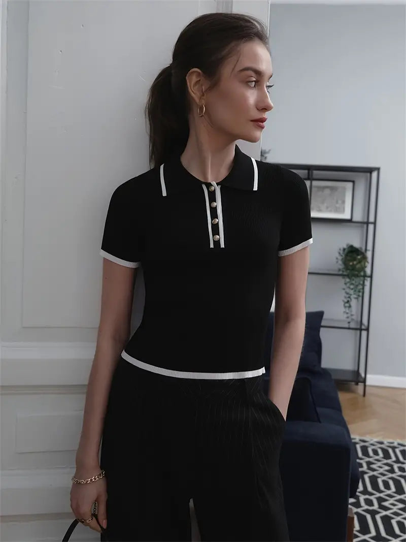 Woman wearing white ribbed knit polo shirt with brown belt and beige trousers