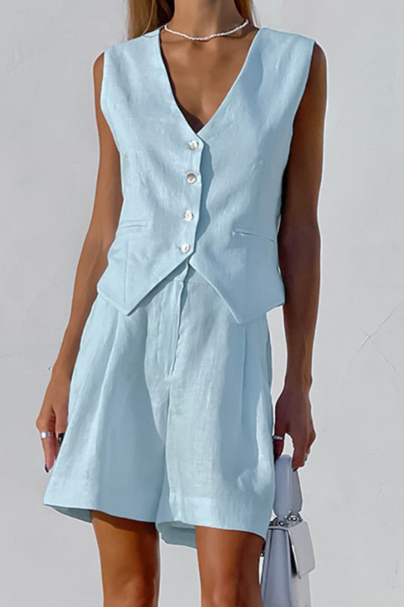 Woman in white linen vest and shorts set