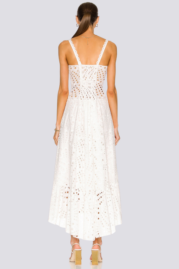 Woman wearing white eyelet embroidered midi dress