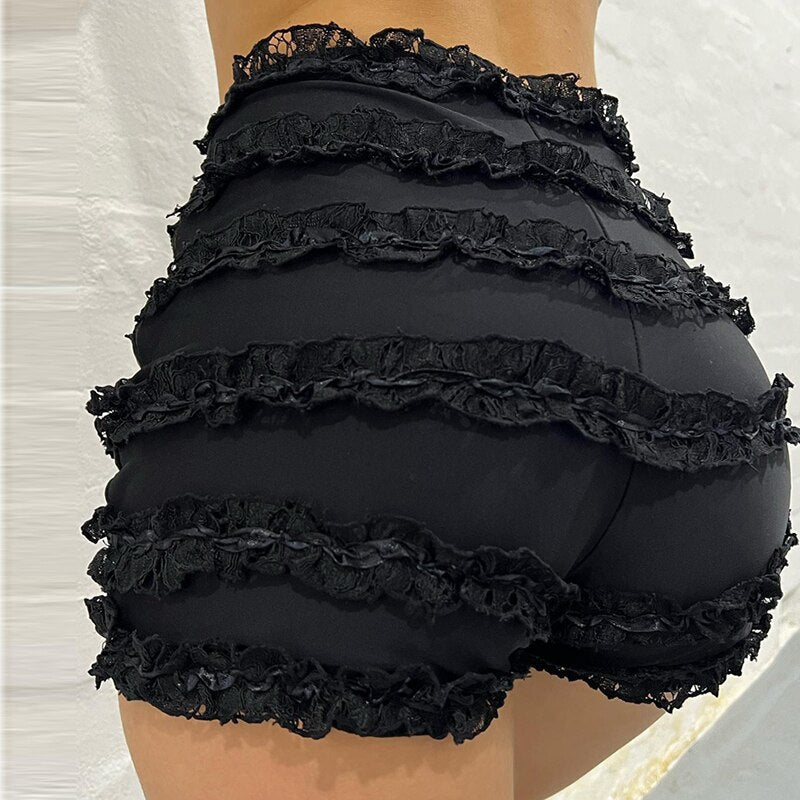 Woman wearing a white ruffle-tiered lace shorts