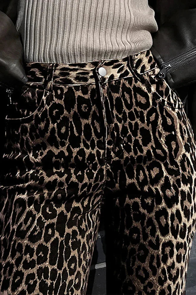 Woman wearing leopard print wide leg jeans and beige trench coat