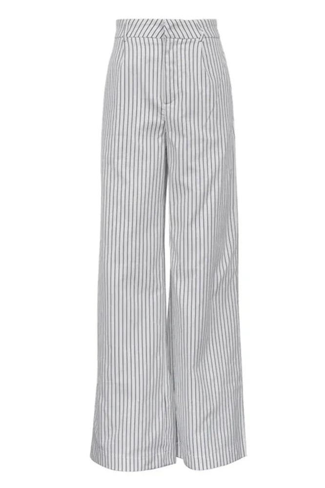Woman wearing white and gray striped linen wide-leg pants