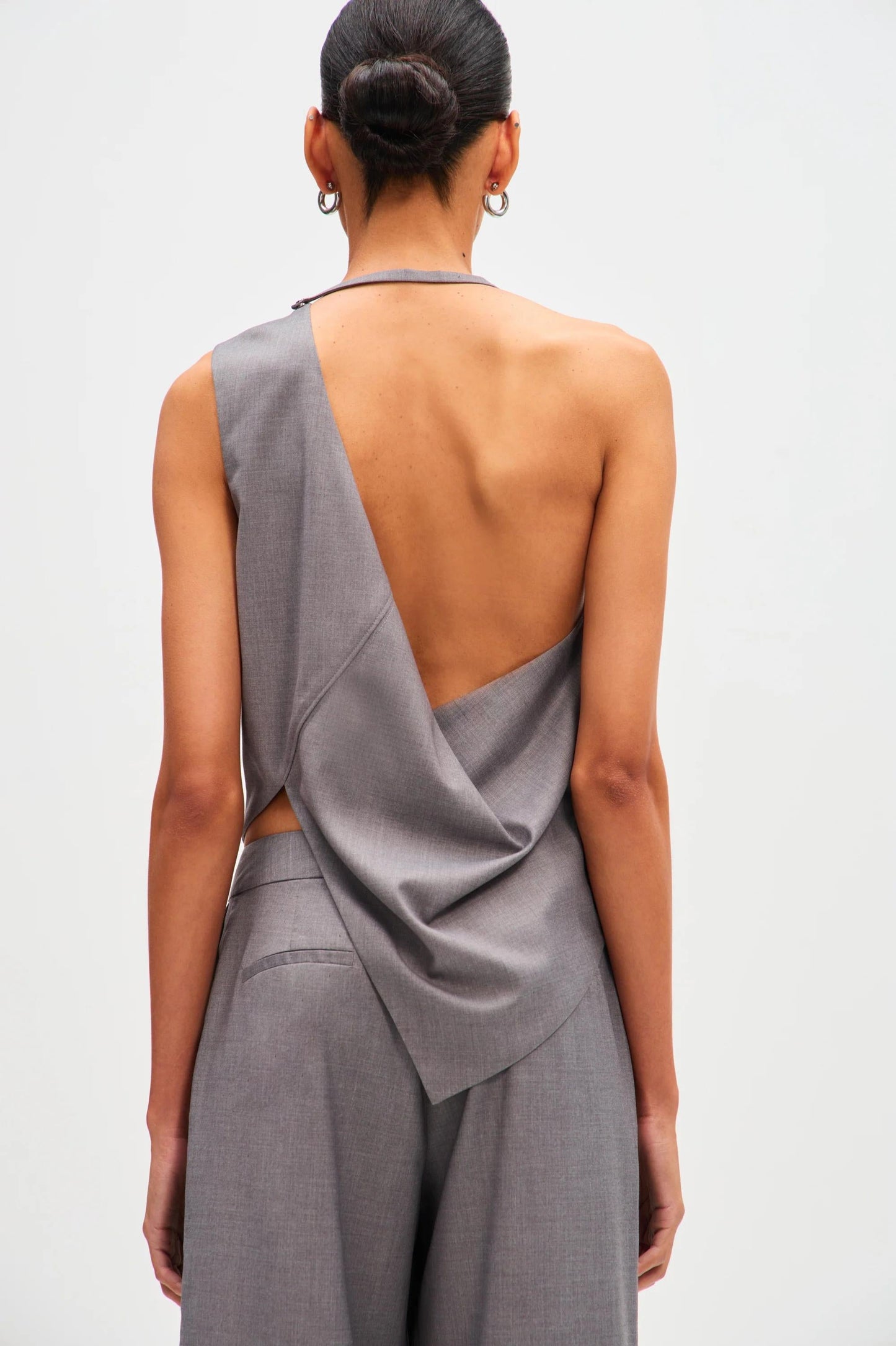 Woman in gray wool blend pant suit