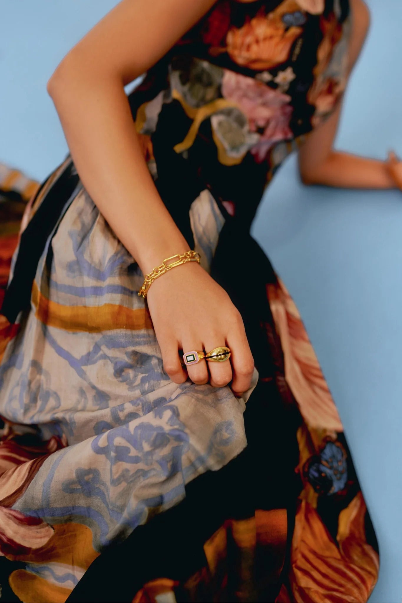 Woman in floral print chiffon maxi dress