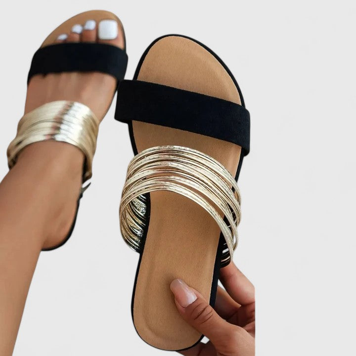 Cream White - Women's slip-on flat sandals featuring a solid faux-suede toe strap, a multi-strap midfoot band, and a contoured footbed.