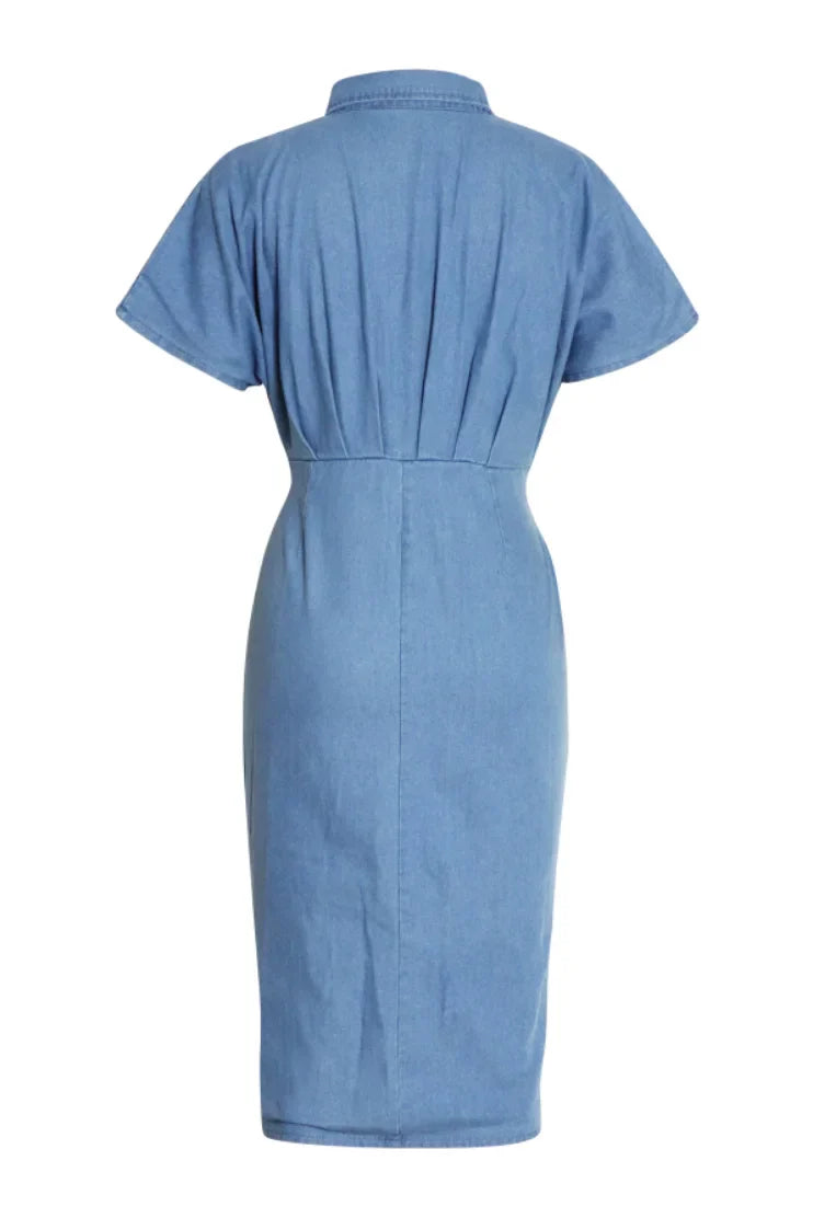 Woman in light blue denim shirt dress with tie waist.