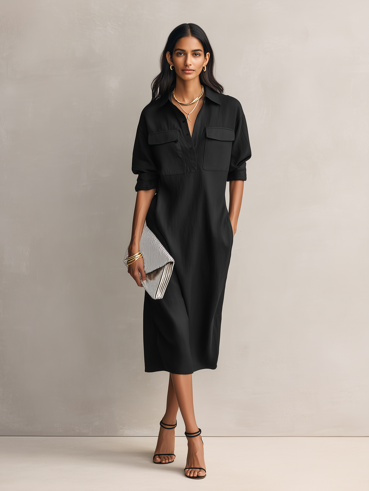 Apricot - Model wearing a relaxed fit collared midi shirtdress with chest pockets and rolled sleeves, styled with gold jewelry and strappy heels
