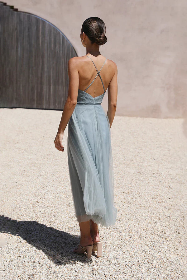 Woman in sage green tulle midi dress