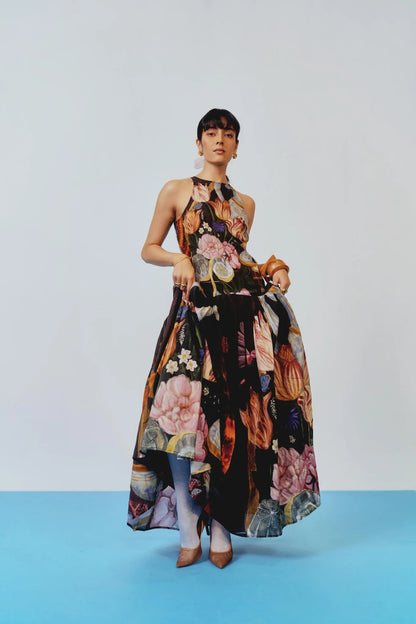 Woman in floral print chiffon maxi dress