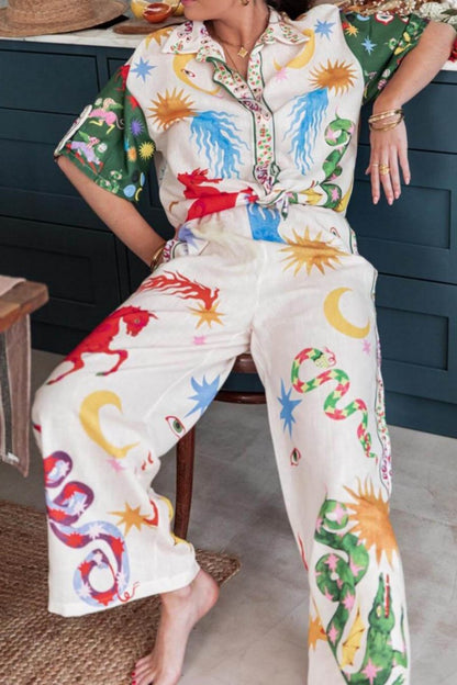 Woman wearing ivory linen pajama set with celestial print