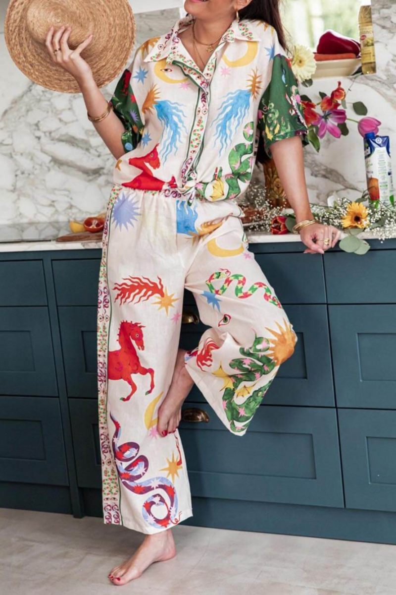 Woman wearing ivory linen pajama set with celestial print