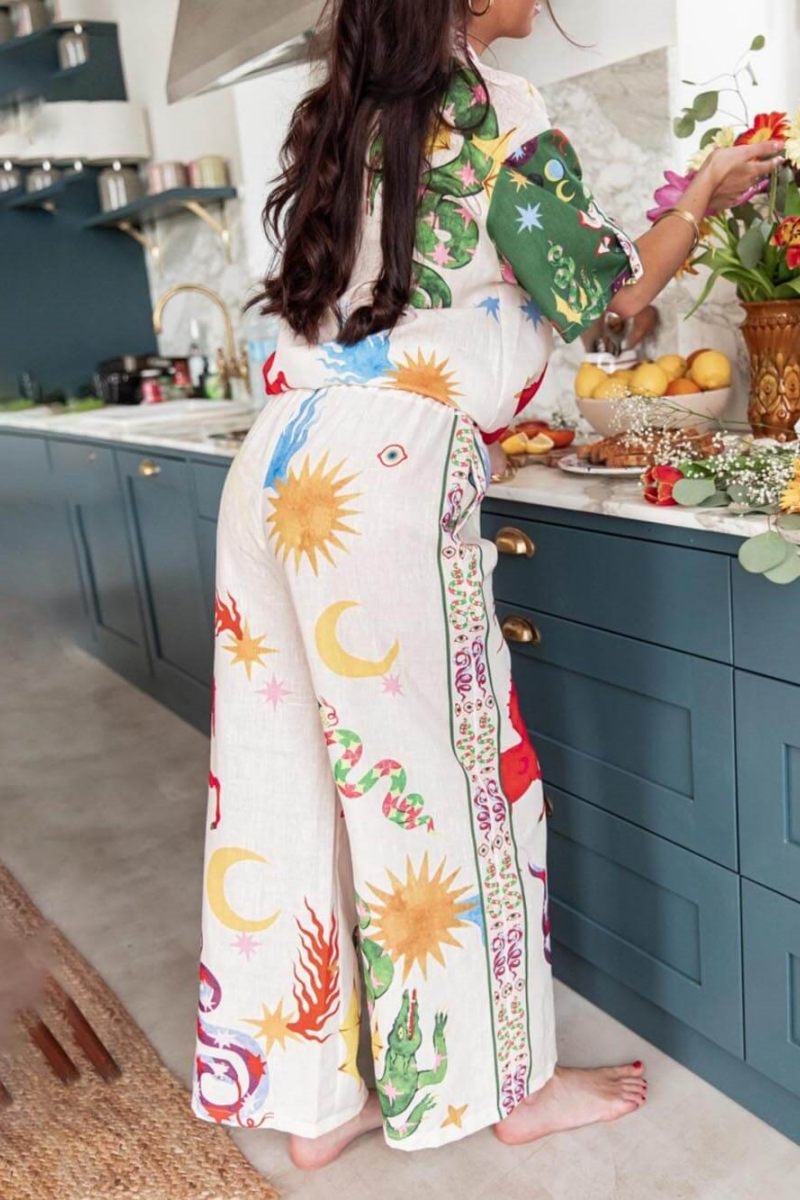 Woman wearing ivory linen pajama set with celestial print