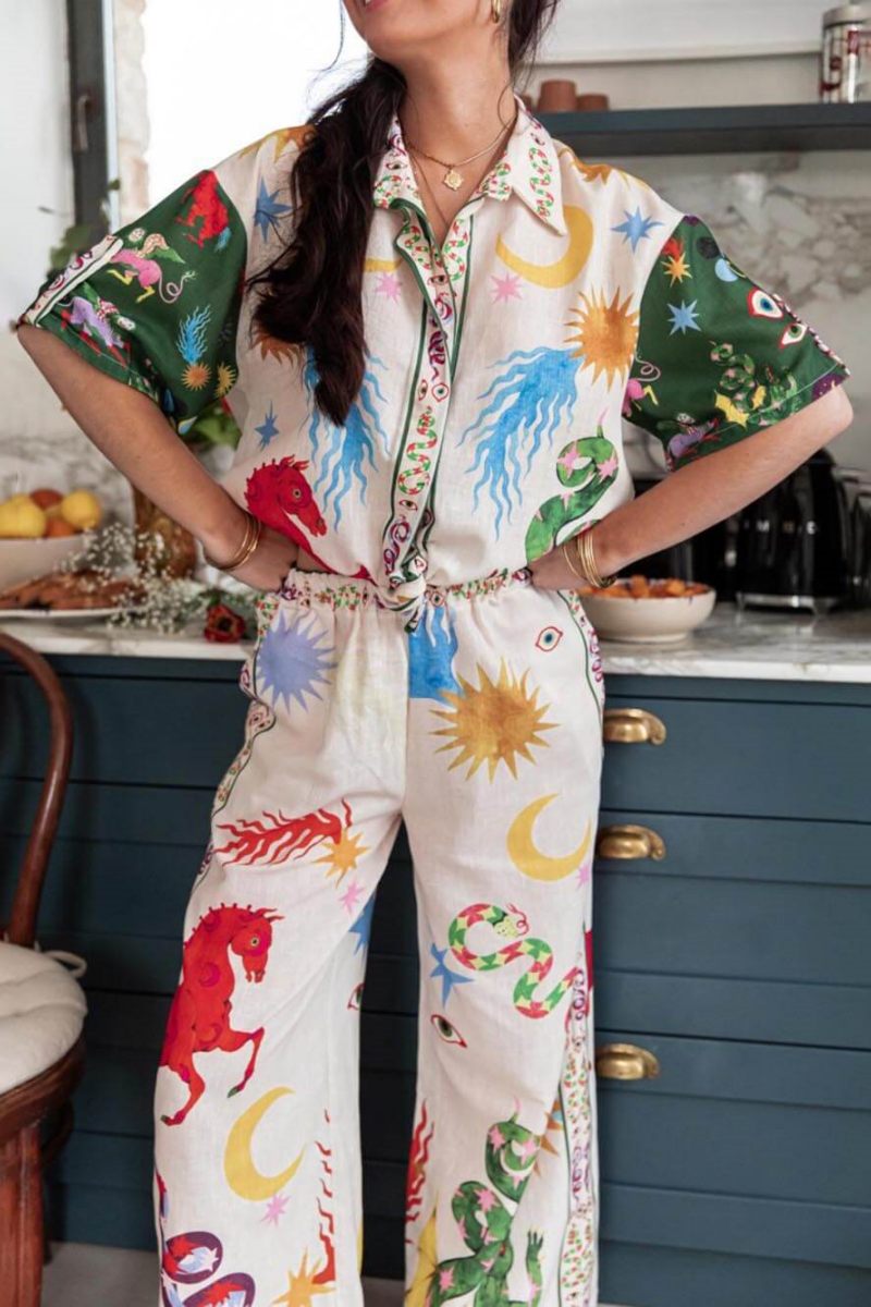 Woman wearing ivory linen pajama set with celestial print