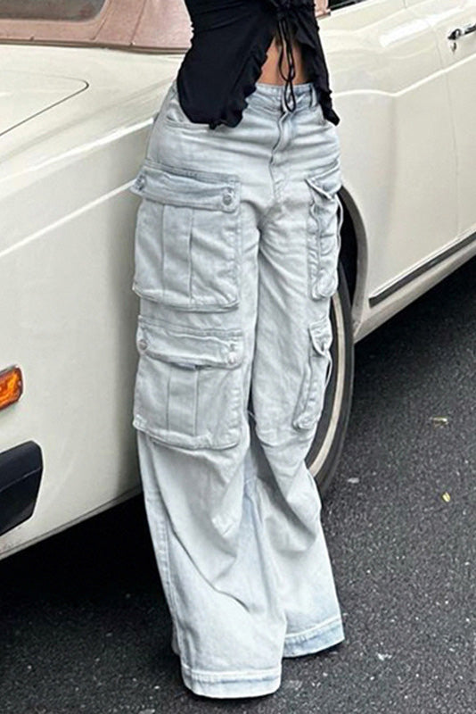 Light wash denim cargo pants with wide legs and multiple pockets.