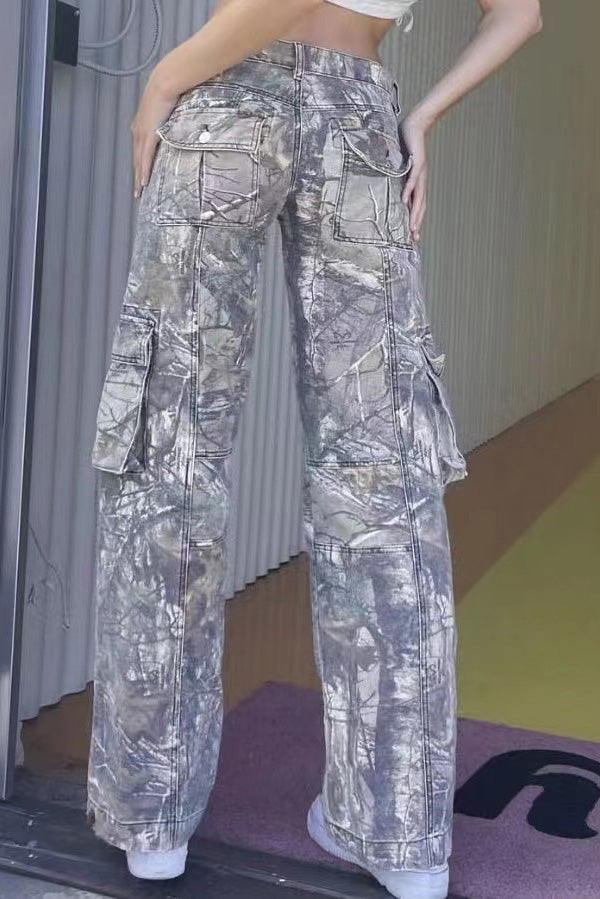 Camouflage print cargo pants with wide legs and low rise.