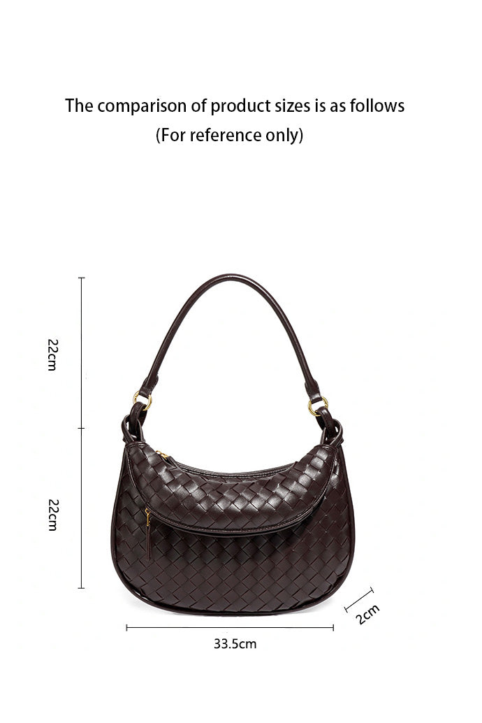 Woman holding dark brown woven leather hobo bag