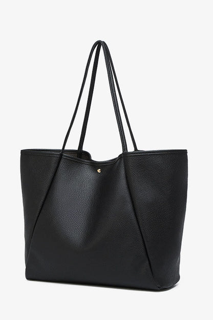 Black faux leather tote bag with shoulder straps