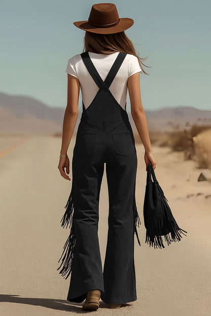 Woman in brown suede fringe overalls and hat walking in desert landscape