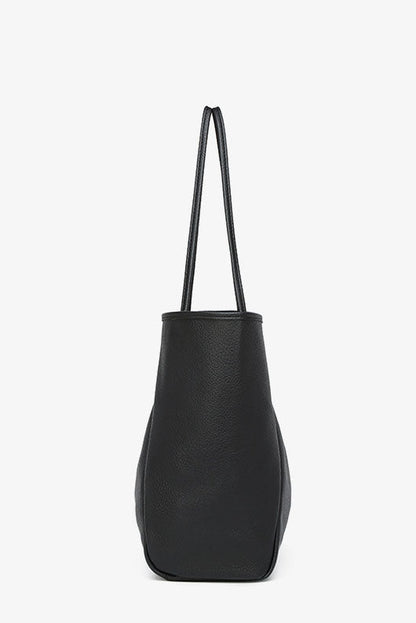Black faux leather tote bag with shoulder straps