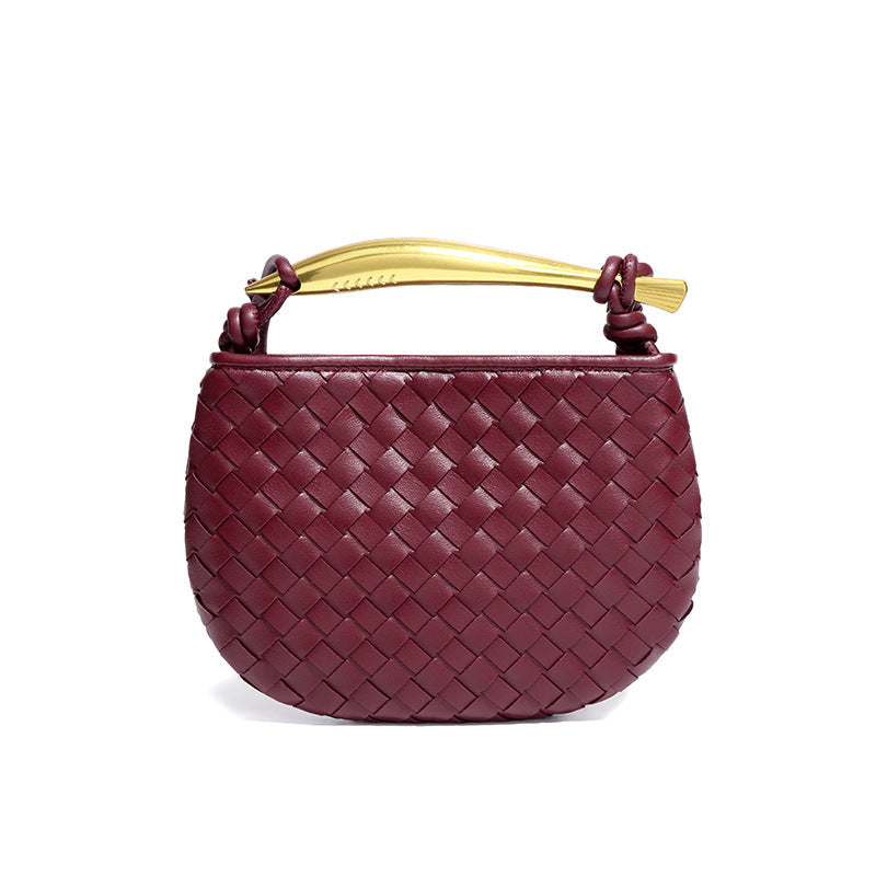 Silver woven leather top handle bag with gold hardware
