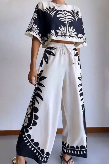Woman wearing cream and black linen pant set with floral print