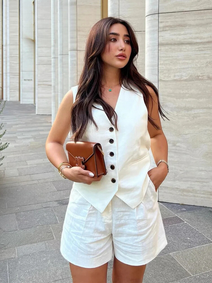 Woman wearing white linen vest and shorts set