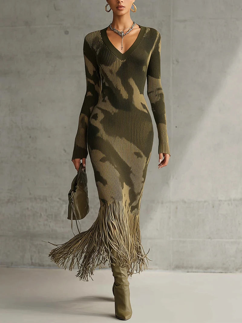 Woman in olive green camo print knit dress with fringe hem