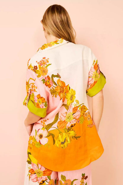 Woman in colorful floral linen pant set