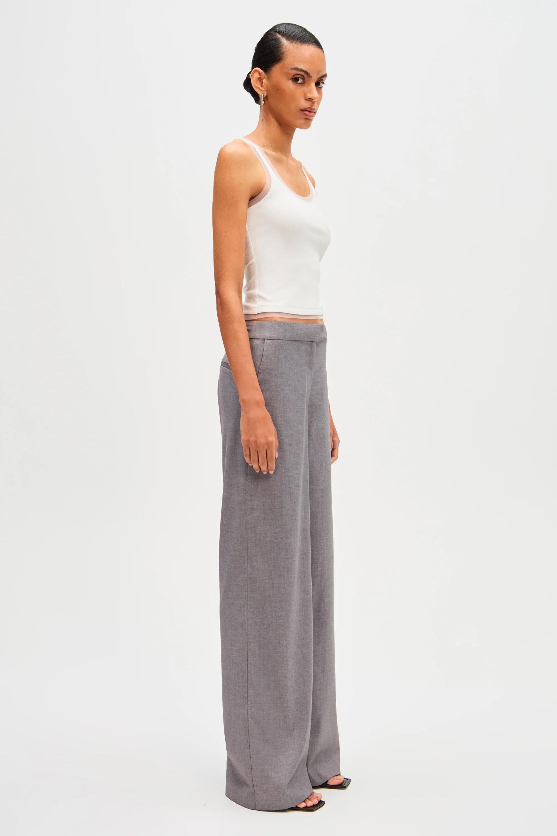 Woman in gray wool blend pant suit