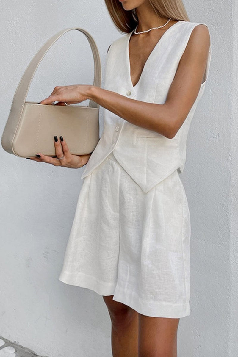 Woman in white linen vest and shorts set