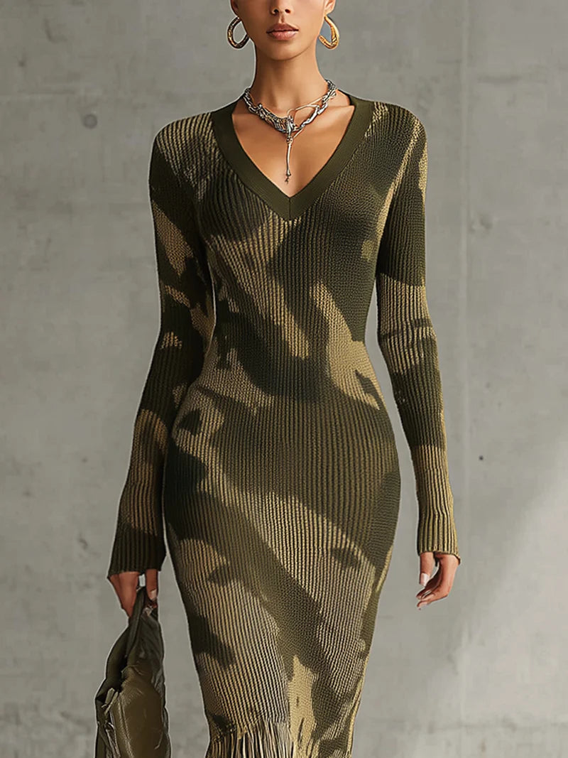 Woman in olive green camo print knit dress with fringe hem