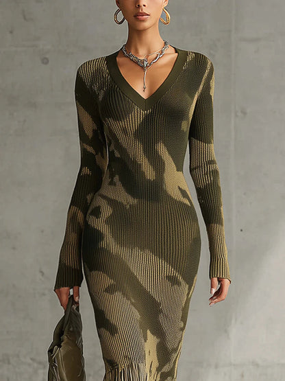 Woman in olive green camo print knit dress with fringe hem
