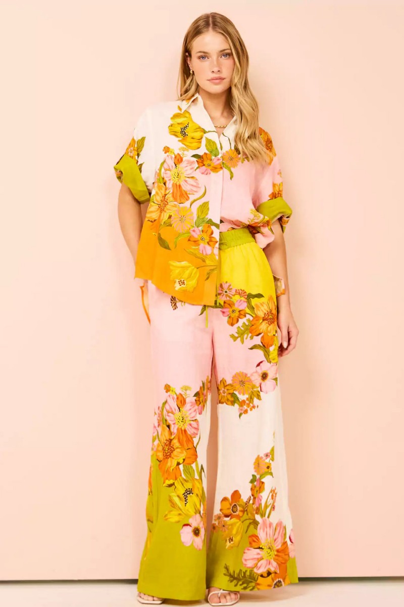 Woman in colorful floral linen pant set