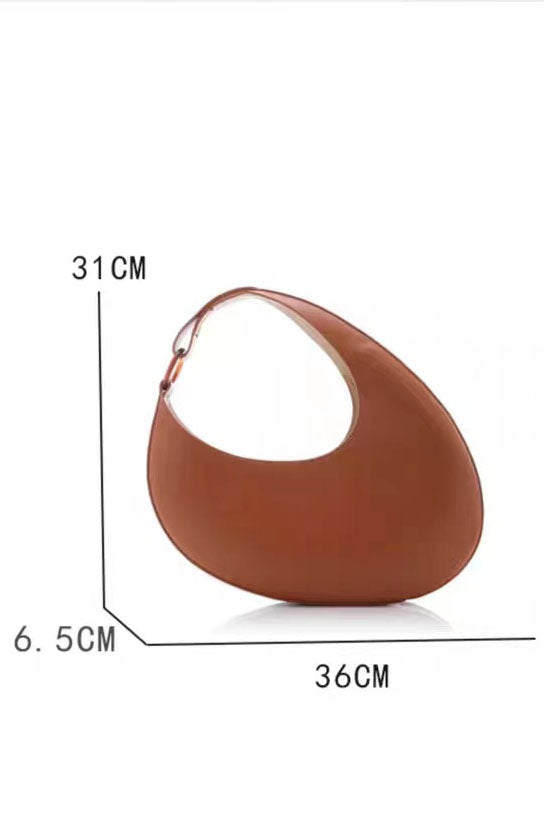 Tan leather crescent-shaped shoulder bag with top handle