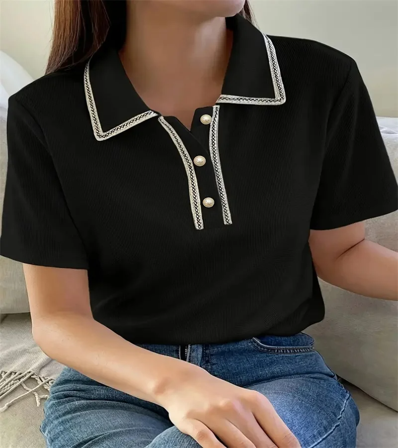 Woman wearing off-white ribbed knit polo shirt with pearl buttons.
