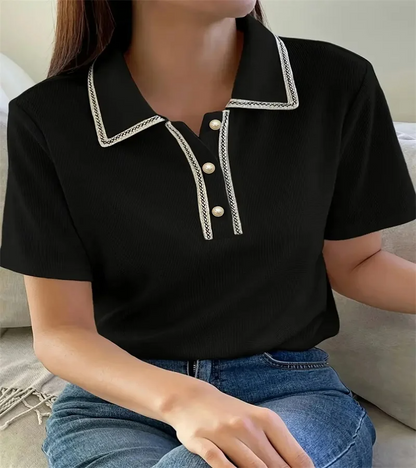 Woman wearing off-white ribbed knit polo shirt with pearl buttons.