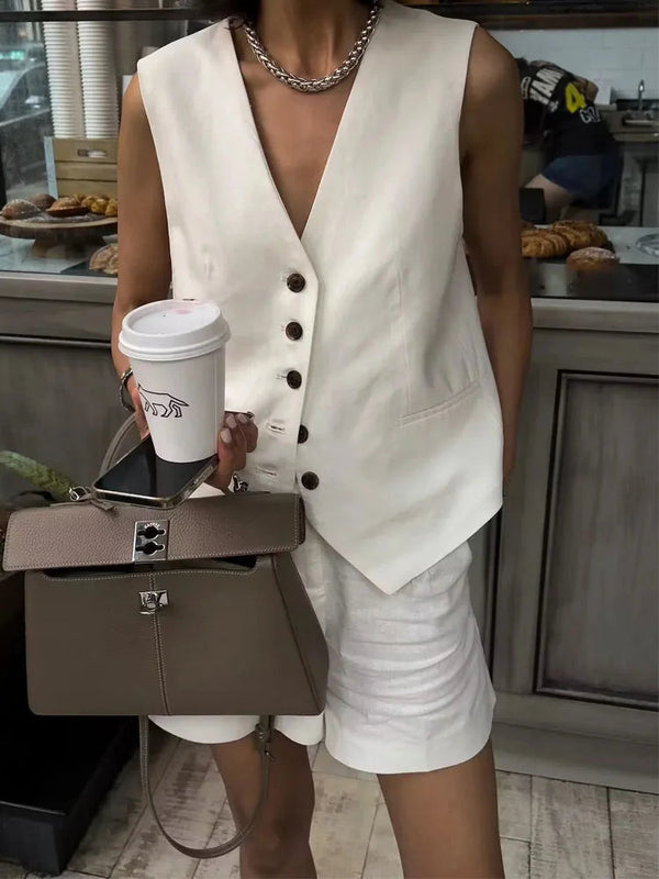 Woman wearing white linen vest and shorts set