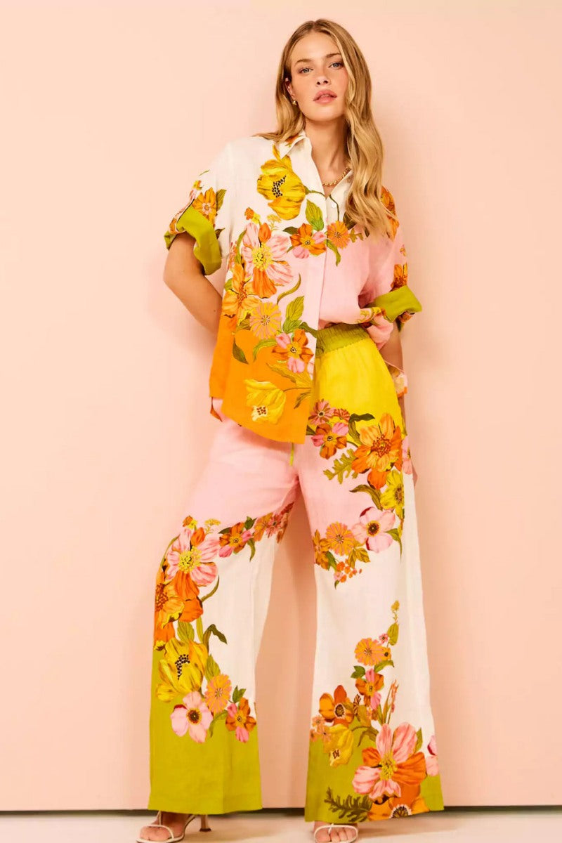 Woman in colorful floral linen pant set