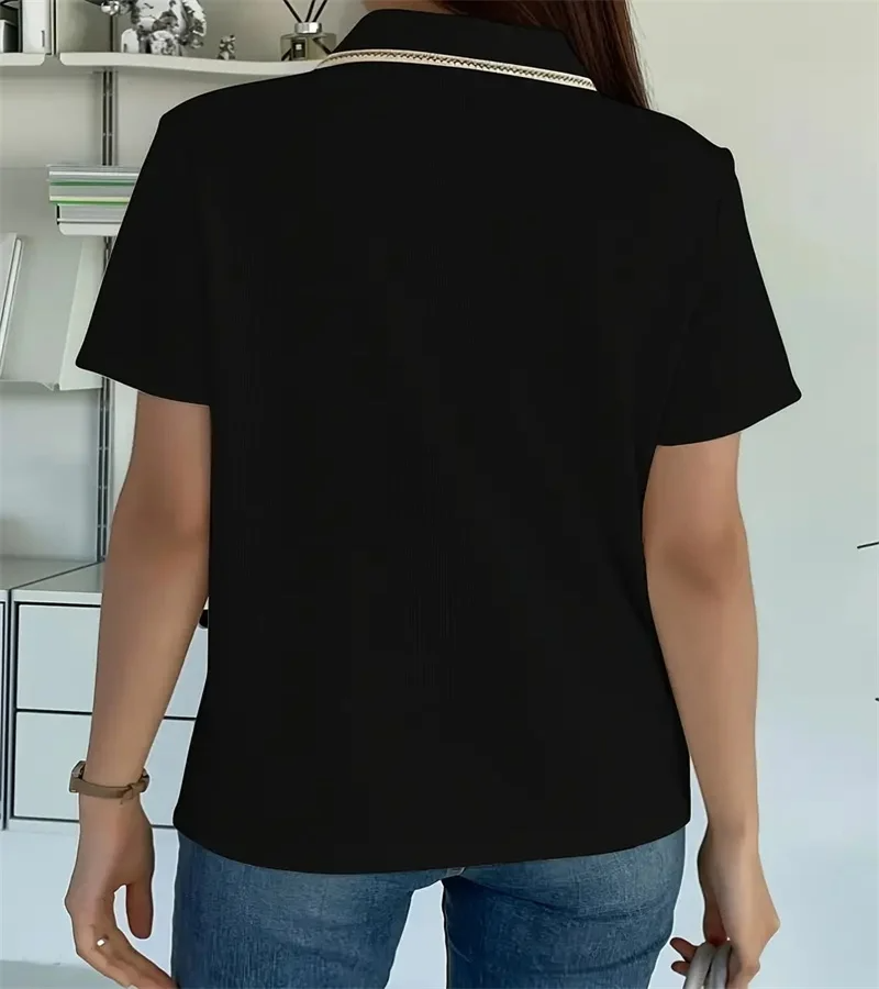 Woman wearing off-white ribbed knit polo shirt with pearl buttons.