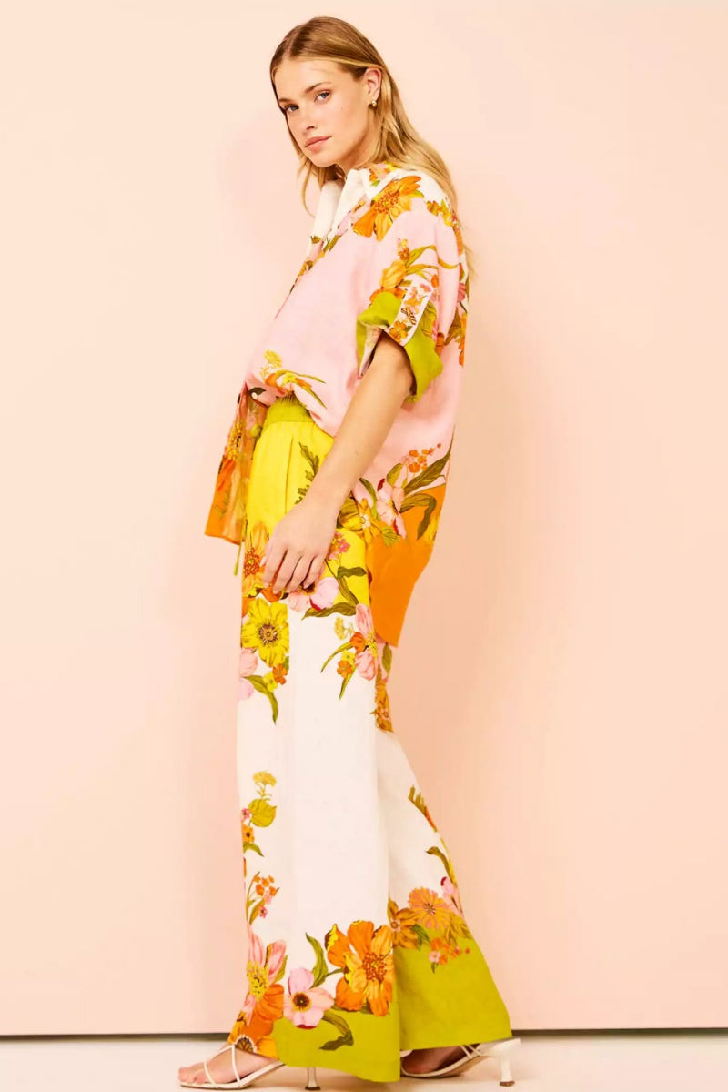 Woman in colorful floral linen pant set