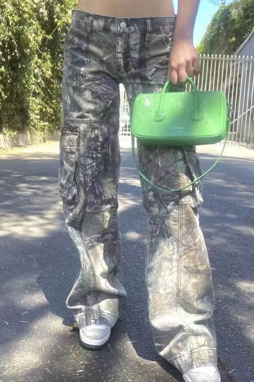 Camouflage print cargo pants with wide legs and low rise.