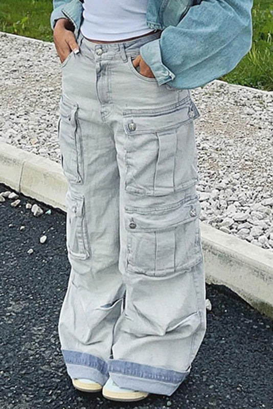 Light wash denim cargo pants with wide legs and multiple pockets.