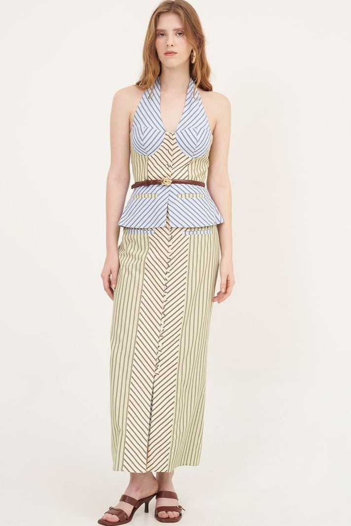 Woman in striped halter top and maxi skirt set