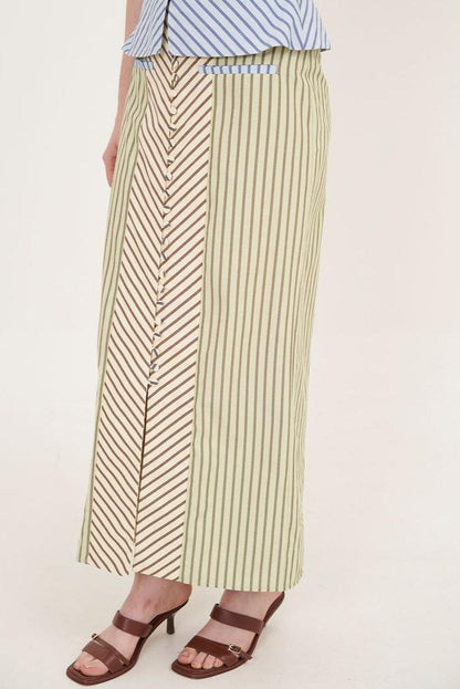 Woman in striped halter top and maxi skirt set