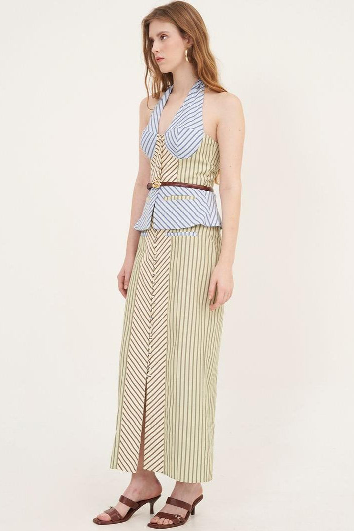 Woman in striped halter top and maxi skirt set
