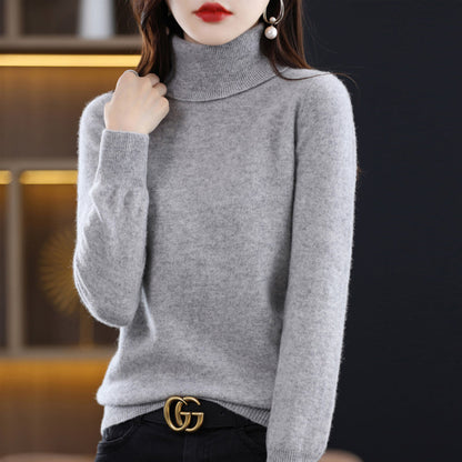 Woman wearing light blue cashmere turtleneck sweater