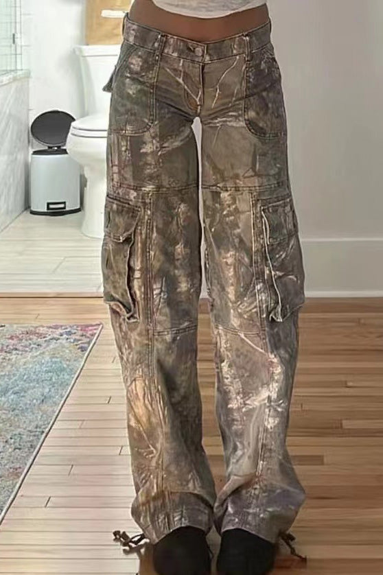 Camouflage print cargo pants with wide legs and low rise.