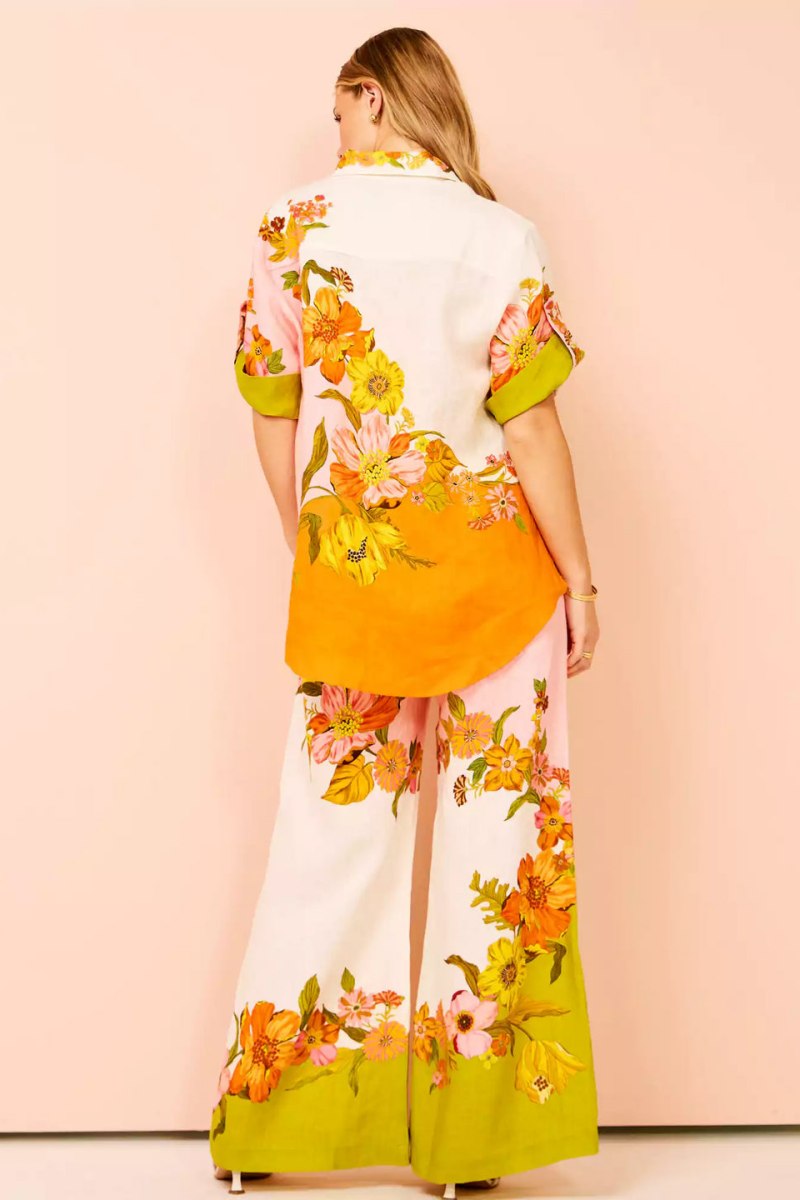 Woman in colorful floral linen pant set