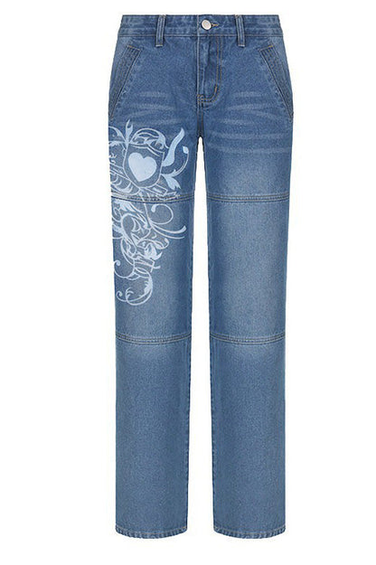 Woman wearing wide leg blue denim jeans with white graphic design