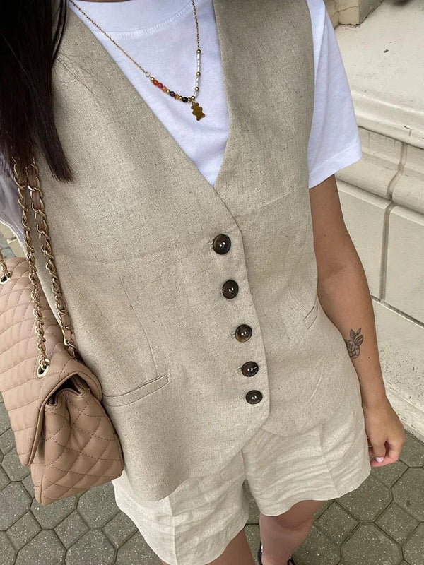 Woman wearing white linen vest and shorts set